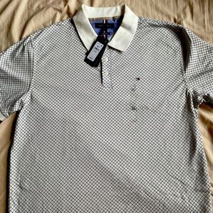 Mens Tommy Hilfiger polo shirt in a white color with unique navy blue design!